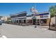 Street view with restaurants featuring outdoor seating and classic storefronts at 945 Saint Andrews Ln, Louisville, CO 80027