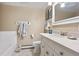 Bright bathroom featuring a white vanity, tub, and stylish tile flooring at 1555 Genesee Ridge Rd, Golden, CO 80401