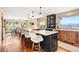 Spacious kitchen features a large center island, barstool seating, and mountain views at 1555 Genesee Ridge Rd, Golden, CO 80401