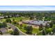 Aerial view highlighting the neighborhood's proximity to the local school and green spaces at 9939 E Aberdeen Ave, Englewood, CO 80111