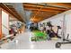 Unfinished basement with wood framing, exercise equipment, and room for activities at 9939 E Aberdeen Ave, Englewood, CO 80111