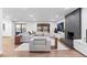 Bright and airy living room featuring a modern fireplace, comfortable seating, and ample natural light at 9939 E Aberdeen Ave, Englewood, CO 80111