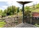 Elevated deck overlooks a lush backyard with tiered landscaping at 14150 Foothill Ln, Golden, CO 80401