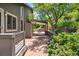 Scenic backyard showcasing a patio, lush trees, and beautiful landscaping at 14150 Foothill Ln, Golden, CO 80401