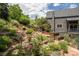 Landscaped backyard featuring stone steps and a tiered garden at 14150 Foothill Ln, Golden, CO 80401