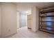 Large basement with a closet, shelves, and a vintage fridge at 14150 Foothill Ln, Golden, CO 80401