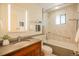 Updated bathroom with modern vanity, stylish lighting, and shower-tub combo at 14150 Foothill Ln, Golden, CO 80401