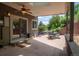 Enjoy outdoor living on this covered patio with ceiling fan and views of the landscaped backyard at 14150 Foothill Ln, Golden, CO 80401