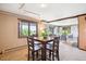 Cozy dining area with seating for four and natural light from nearby windows at 14150 Foothill Ln, Golden, CO 80401