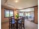 Dining room leading to the living room, with large window and natural light at 14150 Foothill Ln, Golden, CO 80401