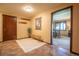 Inviting entryway with a bench, coat hooks, and views into an adjacent room at 14150 Foothill Ln, Golden, CO 80401