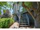 Close-up of the home's exterior with modern staircase and landscaped path at 14150 Foothill Ln, Golden, CO 80401