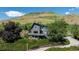 Contemporary two-story home with gray exterior and a hillside view at 14150 Foothill Ln, Golden, CO 80401