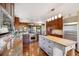 A spacious kitchen with wood cabinets, stainless steel appliances, and butcher block island at 14150 Foothill Ln, Golden, CO 80401