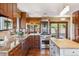 Spacious kitchen features wood cabinets, granite countertops, stainless steel appliances, and hardwood floors at 14150 Foothill Ln, Golden, CO 80401