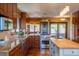 Gourmet kitchen with granite counters, wood cabinets, stainless steel appliances, and center island at 14150 Foothill Ln, Golden, CO 80401