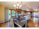 Open kitchen and dining area with wood floors, breakfast bar, and sliding door access to outdoor space at 14150 Foothill Ln, Golden, CO 80401