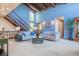 Spacious living room with vaulted ceilings and contemporary furniture at 14150 Foothill Ln, Golden, CO 80401