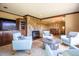 Cozy living room with stone fireplace and comfortable seating at 14150 Foothill Ln, Golden, CO 80401