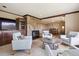 Spacious living room includes stone fireplace, TV, and comfortable seating at 14150 Foothill Ln, Golden, CO 80401