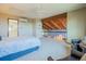 Bright main bedroom with high ceilings and balcony that overlooks a living area at 14150 Foothill Ln, Golden, CO 80401