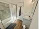Clean bathroom with a white vanity, granite countertop, updated fixtures, and a shower with a gray-tiled wall at 6800 E Tennessee Ave # 351, Denver, CO 80224