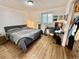 Bedroom featuring a gray bed, neutral walls, and ample natural light at 6800 E Tennessee Ave # 351, Denver, CO 80224