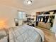 Bright bedroom with a large closet, modern workstation, and comfortable gray quilted bedding at 6800 E Tennessee Ave # 351, Denver, CO 80224