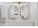 Bathroom featuring double sinks, marble countertops, and views into the bedroom at 2736 Poplar Grove Pl, Castle Rock, CO 80109