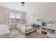 Charming bedroom featuring a twin bed and decorative shelving at 2736 Poplar Grove Pl, Castle Rock, CO 80109