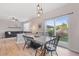Bright dining area featuring modern lighting and sliding glass doors to the outdoor space at 2736 Poplar Grove Pl, Castle Rock, CO 80109