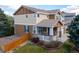 Two-story home with a cozy front porch and a fenced yard, perfect for families at 2736 Poplar Grove Pl, Castle Rock, CO 80109
