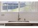 Close-up of the kitchen sink with sleek faucet and bright backsplash, perfect for culinary enthusiasts at 2736 Poplar Grove Pl, Castle Rock, CO 80109