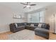 Comfortable living room features a large sectional sofa, ceiling fan, and ample natural light at 2736 Poplar Grove Pl, Castle Rock, CO 80109