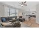 Open-concept living room flows into kitchen, creating a modern and welcoming living space at 2736 Poplar Grove Pl, Castle Rock, CO 80109