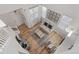 A high-angle of the living room, with wood floors, modern decor, and abundant natural light at 2736 Poplar Grove Pl, Castle Rock, CO 80109