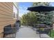 Back patio with lots of seating and a large shade umbrella at 2736 Poplar Grove Pl, Castle Rock, CO 80109