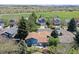Beautiful aerial view shows the property's location, backing onto a field and neighboring houses at 8679 Apache Plume Dr, Parker, CO 80134