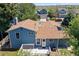 Aerial shot of back of house with deck and a blue exterior at 8679 Apache Plume Dr, Parker, CO 80134
