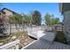Secluded backyard deck and stone-lined garden beds at 8679 Apache Plume Dr, Parker, CO 80134