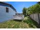 Green backyard with a white deck, complemented by a well-maintained lawn, offering a peaceful outdoor space at 8679 Apache Plume Dr, Parker, CO 80134