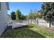 Cozy backyard featuring a small deck, a well-maintained lawn, and a privacy fence at 8679 Apache Plume Dr, Parker, CO 80134