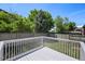 Backyard deck overlooking green grass and a wooden fence, offering privacy and outdoor enjoyment at 8679 Apache Plume Dr, Parker, CO 80134