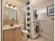 Full bathroom with neutral cabinets, shower, and stacked washer/dryer at 8679 Apache Plume Dr, Parker, CO 80134