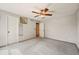 Bedroom with ceiling fan, plush gray carpeting, and neutral walls at 8679 Apache Plume Dr, Parker, CO 80134