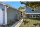 Charming blue home featuring a walkway with a trellised entrance and well-maintained lawn at 8679 Apache Plume Dr, Parker, CO 80134