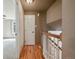 Hallway with hardwood flooring providing access to all areas of the house at 8679 Apache Plume Dr, Parker, CO 80134