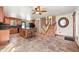 Open kitchen with island seating flows into the staircase to the upper level at 8679 Apache Plume Dr, Parker, CO 80134