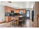 Well-equipped kitchen with island seating and black appliances is ready for cooking and entertaining at 8679 Apache Plume Dr, Parker, CO 80134