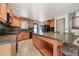 Updated kitchen with granite countertops, large island, stainless appliances, and ample cabinet space at 8679 Apache Plume Dr, Parker, CO 80134